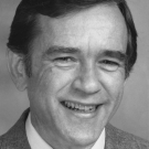 A black and white portrait of R. Larry Merson