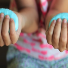 photo of child's hands with silly putty