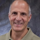 A headshot of Mark Modera
