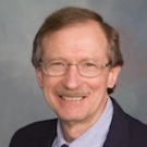 A headshot of John Krochta