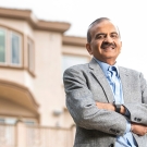 Prem Jain outside in front of his house