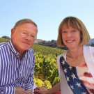 Dr. T.J. Rodgers and his wife Valeta pose for a photo at a vineyard 