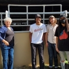 UC Davis Professors and Students pose for photo in front of horse stall